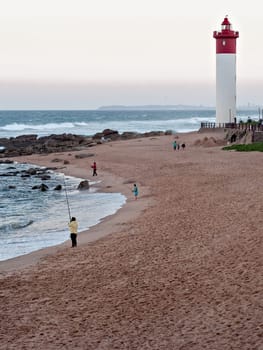 DURBAN, SOUTH AFRICA - JULY 11, 2016: Anglers on the Umhlanga Rocks beachfront near Lighthouse