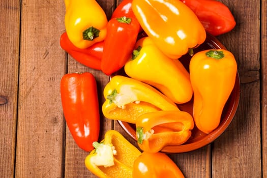 Small bell peppers in red and orange