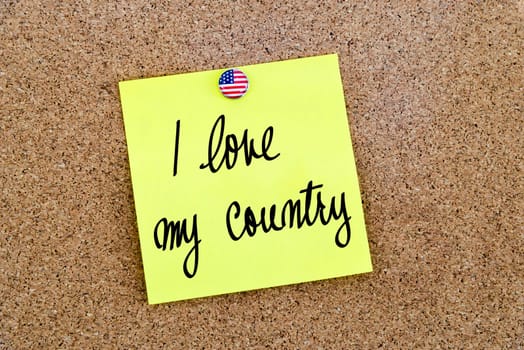 Written text I love My Country over yellow paper note pinned on cork board