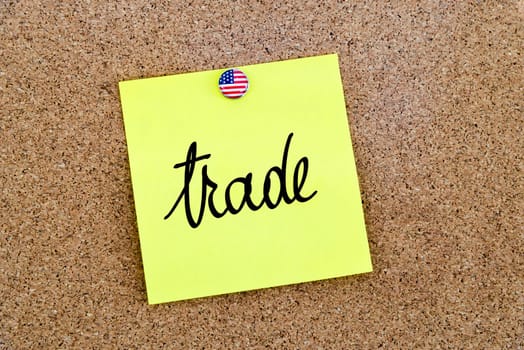 Written text Trade over yellow paper note pinned on cork board