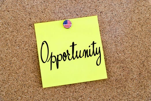 Written text Opportunity over yellow paper note pinned on cork board