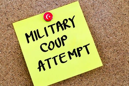 Written text Military Coup Attempt over yellow paper note pinned on cork board
