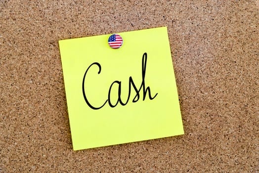 Written text Cash over yellow paper note pinned on cork board