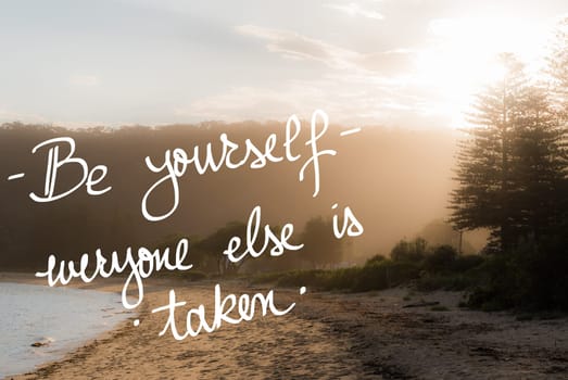 Be Yourself, Everyone Else Is Taken message. Handwritten motivational text over sunset calm sunny beach background with vintage filter applied