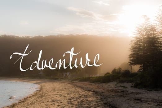 Adventure message. Handwritten motivational text over sunset calm sunny beach background with vintage filter applied