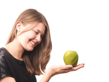 Young happy woman with a green apple on a white background