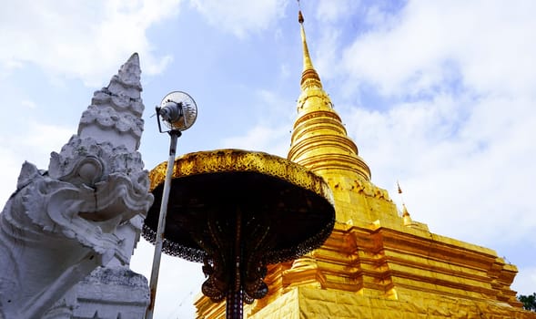 white serpent and golden Pagoda in Temple, nan, Thailand (Wat Chae Haeng).