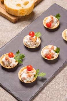 canapes, Appetizer with creamy Chicken salad served on a slate plate