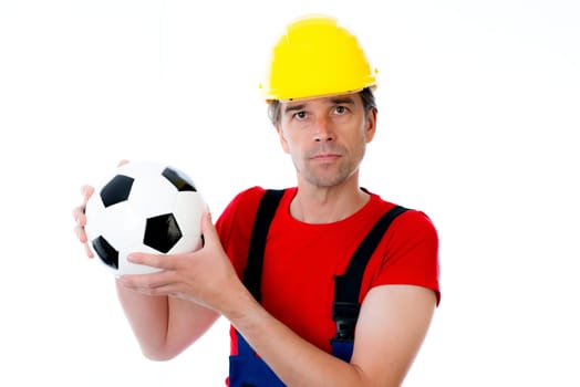 handcrafter with helmet and soccer ball in front of white background