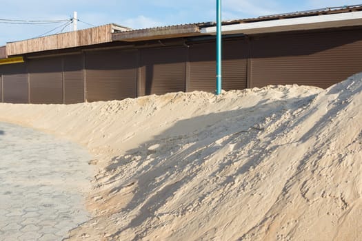 Covered with sand trade pavilions located at the sandy sea beach