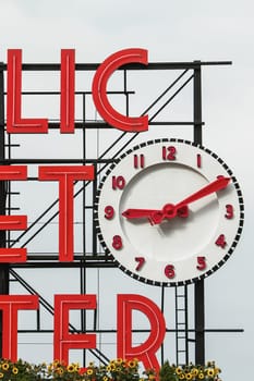 SEATTLE, USA - JULY 29, 2011: Sign and Clock of the Famous Pike Place Market in Seattle, United States.