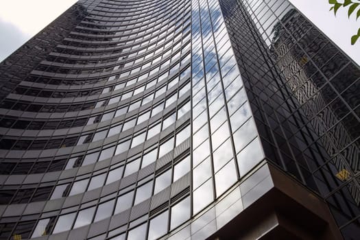 SEATTLE, WASHINGTON, USA - JULY 29, 2011: Reflection of the Sky on Columbia Center in Seattle, Washington, United States. It is the Tallest Skyscraper in the City. The Office Tower Contains 76 Stories Above Ground and Seven Below.
