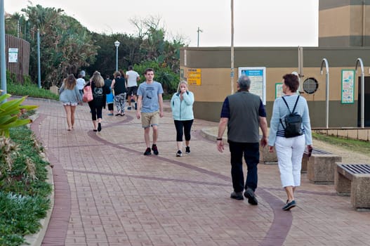 DURBAN, SOUTH AFRICA - JULY 13, 2016: Locals and tourists at Bronze Beach on the Umhlanga Rocks promenade