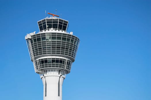 Munich air traffic control tower in airport with clear blue sky and free copy-space place for your text