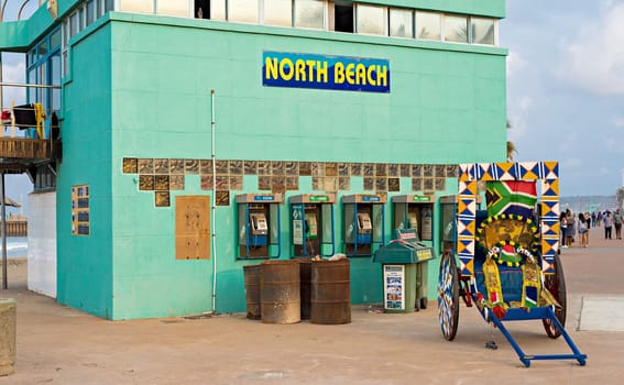 DURBAN, SOUTH AFRICA - AUGUST 17, 2015: Rikshaw at the North Beach lifesaver's station on The Golden Mile promenade