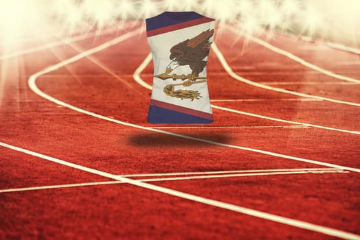red running track with lines and American Samoa flag on shirt