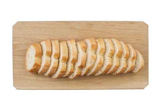 White ciabatta bread being cut in slices on wooden board isolated on white background