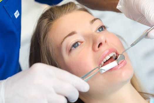Dentist using mirror to get a better view