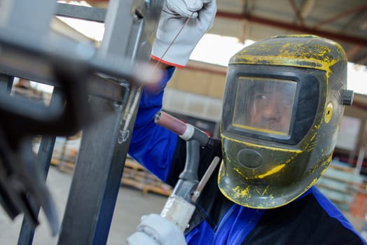man in the factory with mask