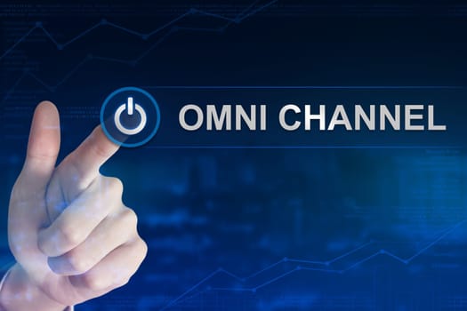 double exposure business hand clicking omni channel button with blurred background