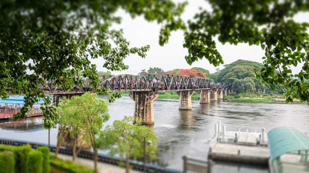 Old bridge over the River Kwai on tilt shift is a historical attractions during World War 2 the famous of Kanchanaburi Province in Thailand,16:9 wide screen