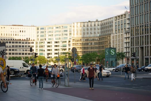 Berlin,Germany - May 10,2016: Road traffic,tourists and pedestrians at Potsdamer Platz opposite an S-Bahn station on May 10,2016 in Berlin.