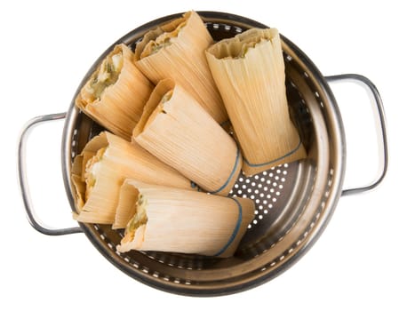 Tamales in steamer ready to be cooked