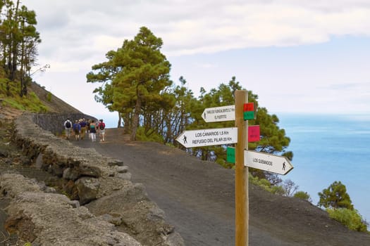 LAS PALMAS, CANARY ISLANDS, SPAIN - OCTOBER 31, 2010: People Hiking and Taking Volcanic Tour on Las Palmas at Canary Islands in Spain.