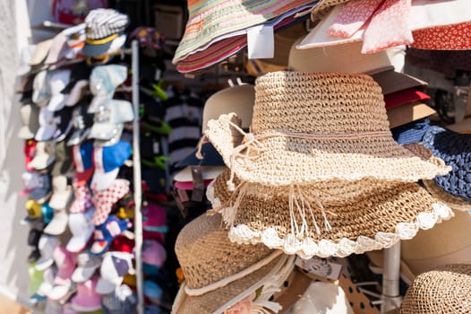 Woman's straw hats , for sale at a market.