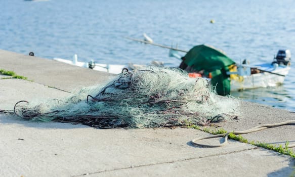 Fishing net to dry on the pier.