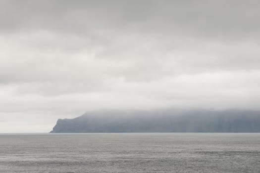 Typical landscape on the Faroe Islands, with water and cliffs