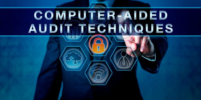Auditor is pushing COMPUTER-AIDED AUDIT TECHNIQUES on a virtual interactive control monitor. Business risk metaphor. Concept for information technology audit, data analysis software and simply CAATs.