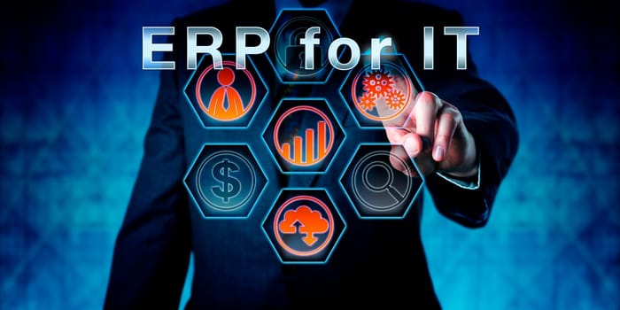Businessman in dark blue suit is touching ERP for IT on an interactive virtual control monitor. Business terminology and acronym meaning Enterprise Resource Planning for Information Technology.