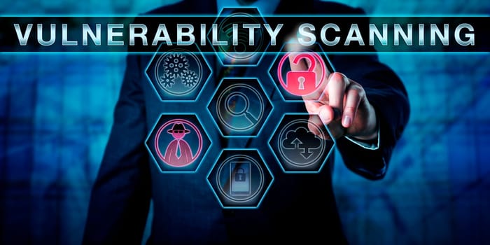 Corporate IT manager touching VULNERABILITY SCANNING on an interactive control screen. Business metaphor for auditing requirements. Network security concept for regular system check for weaknesses.