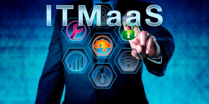 Enterprise executive is pressing ITMaaS on an interactive touch screen. Technology nomenclature and acronym for Information Technology Management as a Service. IT infrastructure concept. Close up.