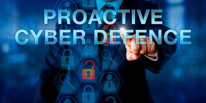 Investigator is touching PROACTIVE CYBER DEFENSE on a virtual interactive screen. Information technology concept and cyber security metaphor for pre-emptive actions opposing a computer attack.