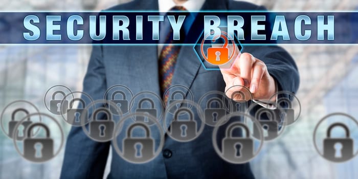 Information systems manager touching the phrase SECURITY BREACH on an interactive control screen. Business metaphor and IT concept for computer security, data security and information security.