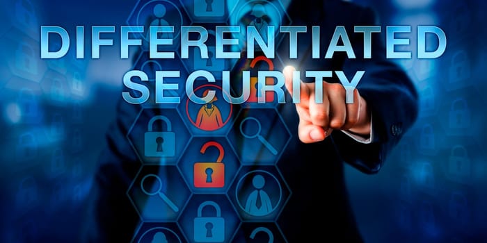Administrator is pressing DIFFERENTIATED SECURITY on an interactive touch screen interface. Information technology concept and computer security metaphor..