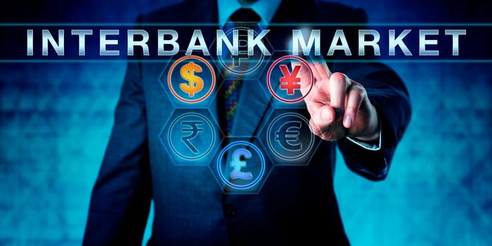 Investor is pressing INTERBANK MARKET on an interactive touch screen. Business metaphor and central banking concept for forex or foreign exchange market. Dollar, pound and yuan or yen lighting up.