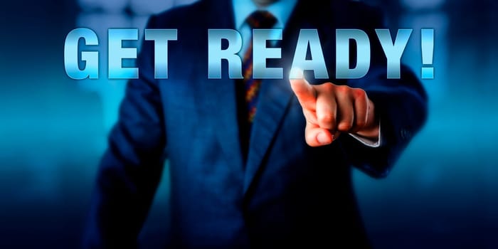 Corporate coach is touching GET READY! on a virtual interactive display. Motivational appeal, call to action and business concept for preparation in anticipation of future events.