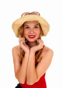 A beautiful blond woman in a red t-shirt, wearing a .straw hat, standing isolated for white background..