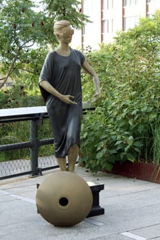 High Line statue. Elevated pedestrian Park and former elevated New York Central Railroad spur called the West Side Line, which runs along the lower west side of Manhattan  it has been redesigned and planted as an aerial greenway. New York City.