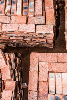 A top view of stacked bricks, ready for the builder to use on compelting the new house.