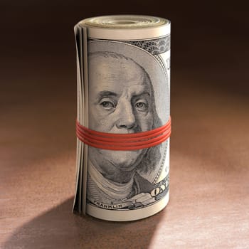 Money roll with elastic gagging the mouth of Benjamin Franklin.