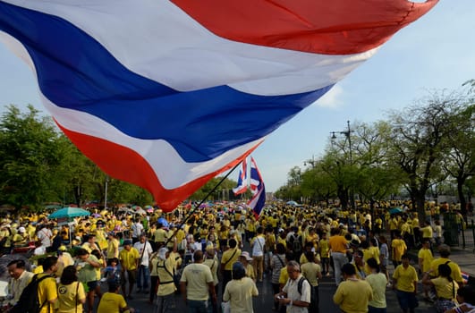 Tousends of Thai People at the ceremony of the coronation Day of the King Bhumibol on the Sanam Square Park on the 5. May in the city of Bangkok in Tahiland, Southeastasia.