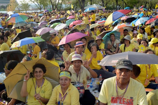 Tousends of Thai People at the ceremony of the coronation Day of the King Bhumibol on the Sanam Square Park on the 5. May in the city of Bangkok in Tahiland, Southeastasia.