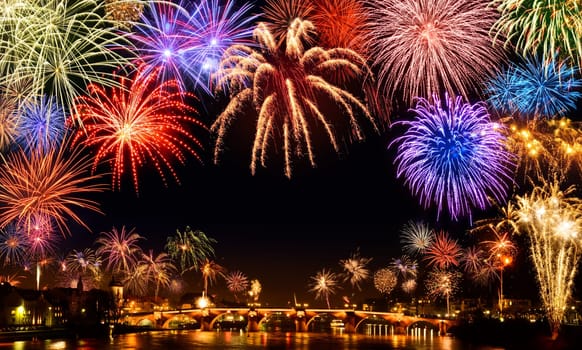 Lively big New Year's Eve fireworks in Heidelberg,with reflection on water