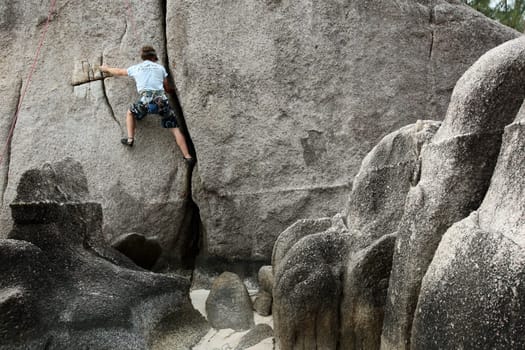 climbing at the Beach at Hat Sai Ri on thel Ko Tao Island in the Gulf of Thailand in the southeast of Thailand in Southeastasia.