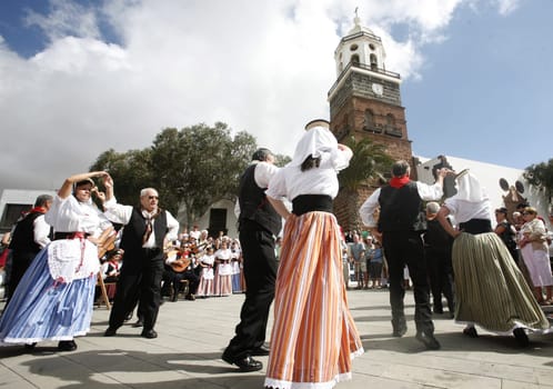a traditional Dance in the old town of Teguise on the Island of Lanzarote on the Canary Islands of Spain in the Atlantic Ocean. on the Island of Lanzarote on the Canary Islands of Spain in the Atlantic Ocean..
