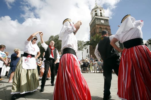 a traditional Dance in the old town of Teguise on the Island of Lanzarote on the Canary Islands of Spain in the Atlantic Ocean. on the Island of Lanzarote on the Canary Islands of Spain in the Atlantic Ocean..